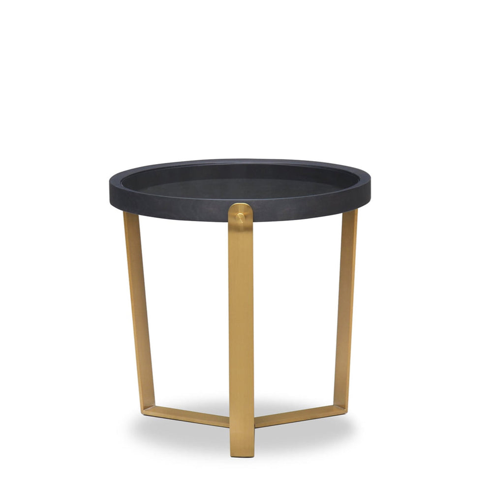 Small round table with black top and gold legs on a white background