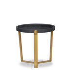 Small round table with black top and gold legs on a white background