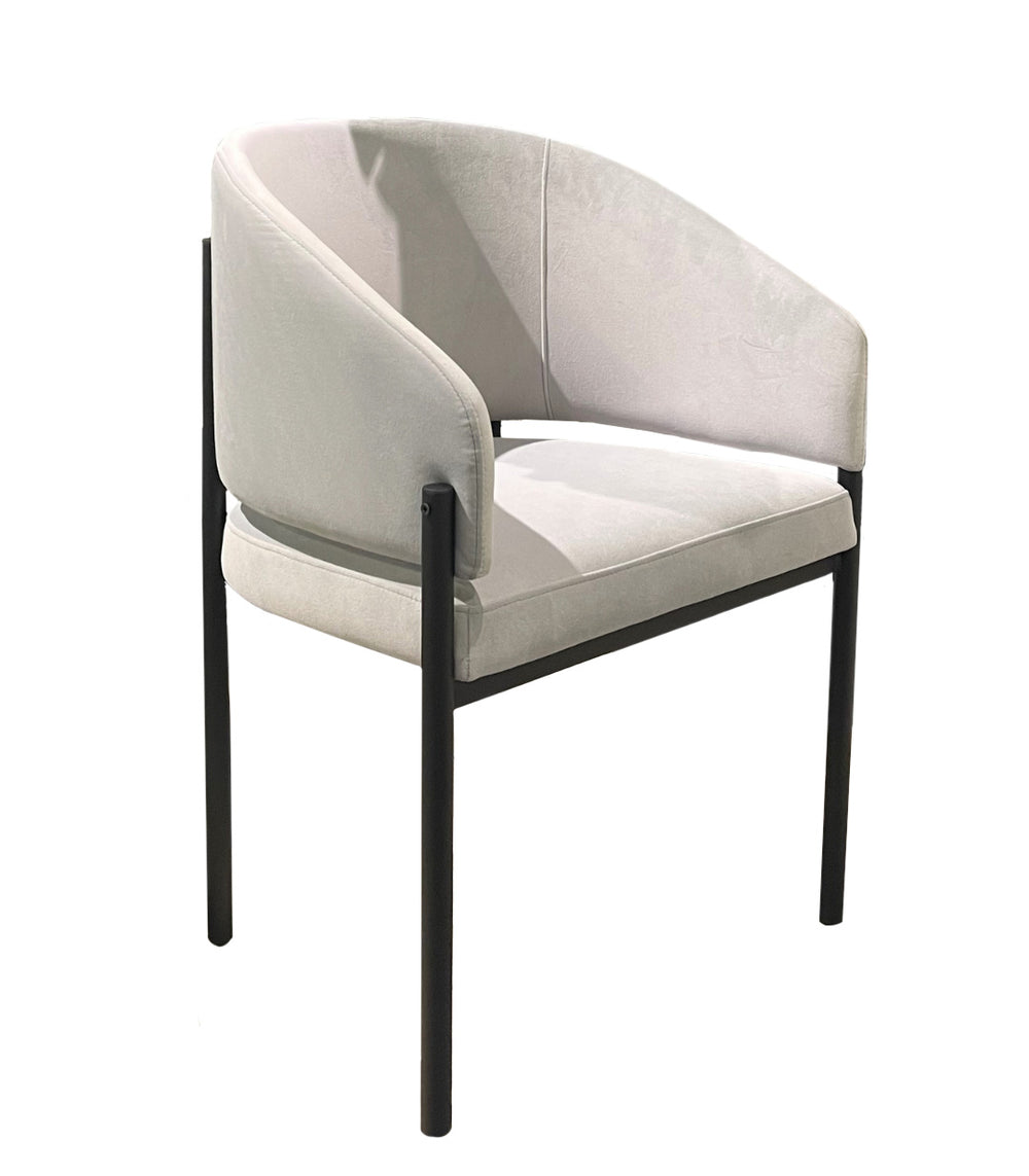 Modern chair with light gray cushion and black frame on a white background