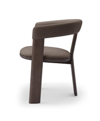 Brown chair with wooden legs on a white background
