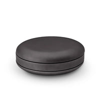 Black round container on a white background