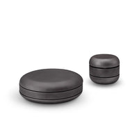 Two black ceramic containers on a white background