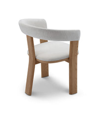 Chair with wooden frame and white cushion on a white background