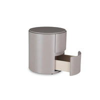 Silver cylindrical nightstand with a drawer on a white background