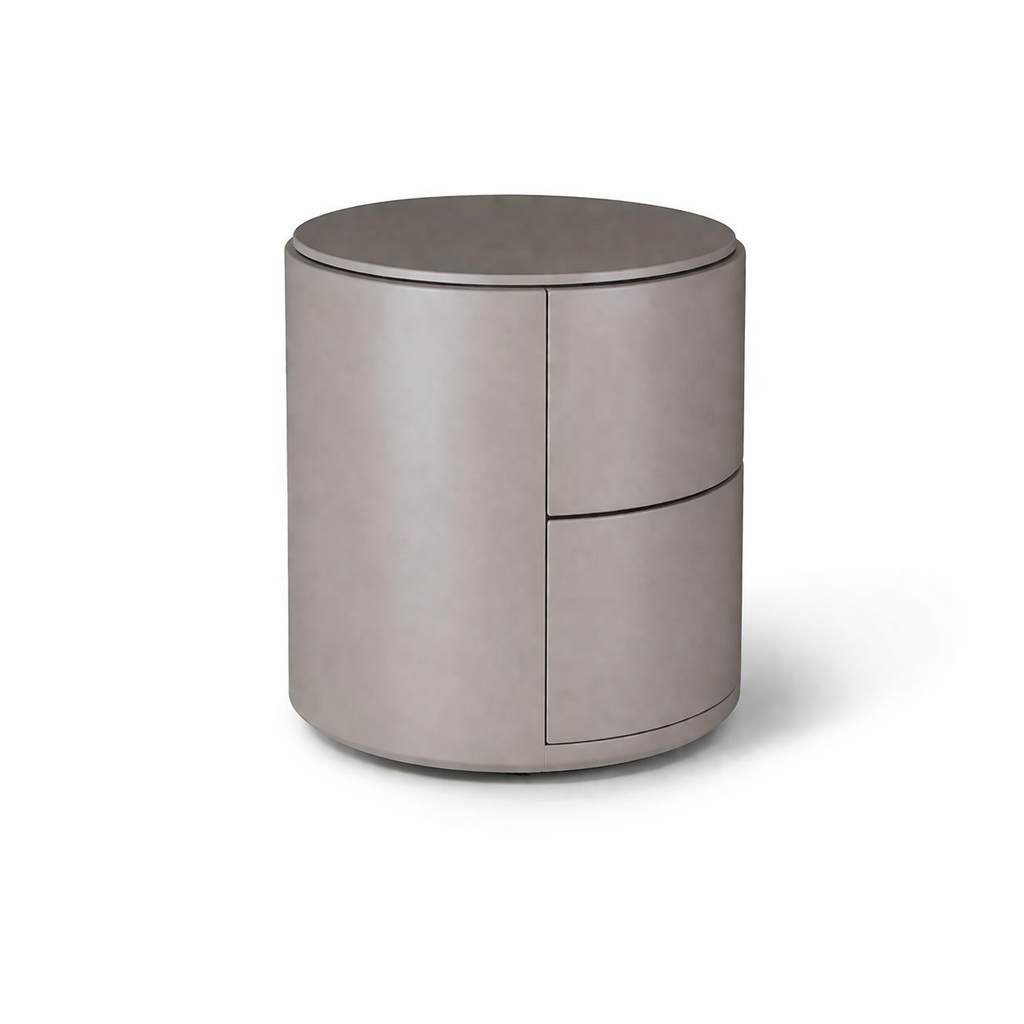 Round metallic side table on a white background