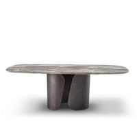 Modern coffee table with a gray stone top and dark base on a white background