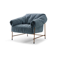 Blue textured armchair with bronze legs on a white background