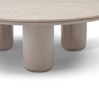 Round table with beige marble top and cylindrical legs on a white background