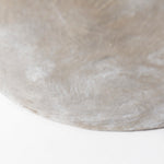 Close-up of a textured concrete surface on a white background