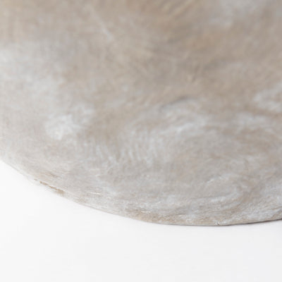 Close-up of a textured concrete surface on a white background