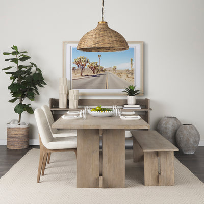 Dining room with wooden table, chairs, and decor elements.