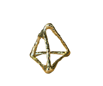 Gold geometric ring on a white background