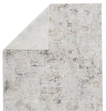 Textured area rug with a neutral color palette on a white background