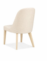 Beige chair with wooden legs on a white background