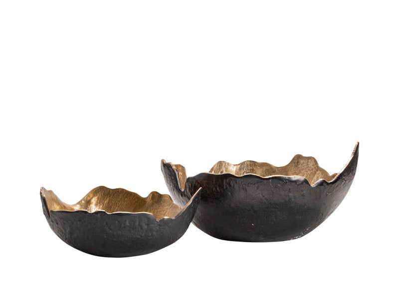 Two decorative bowls, one with a black finish and the other with a gold finish, on a white background.