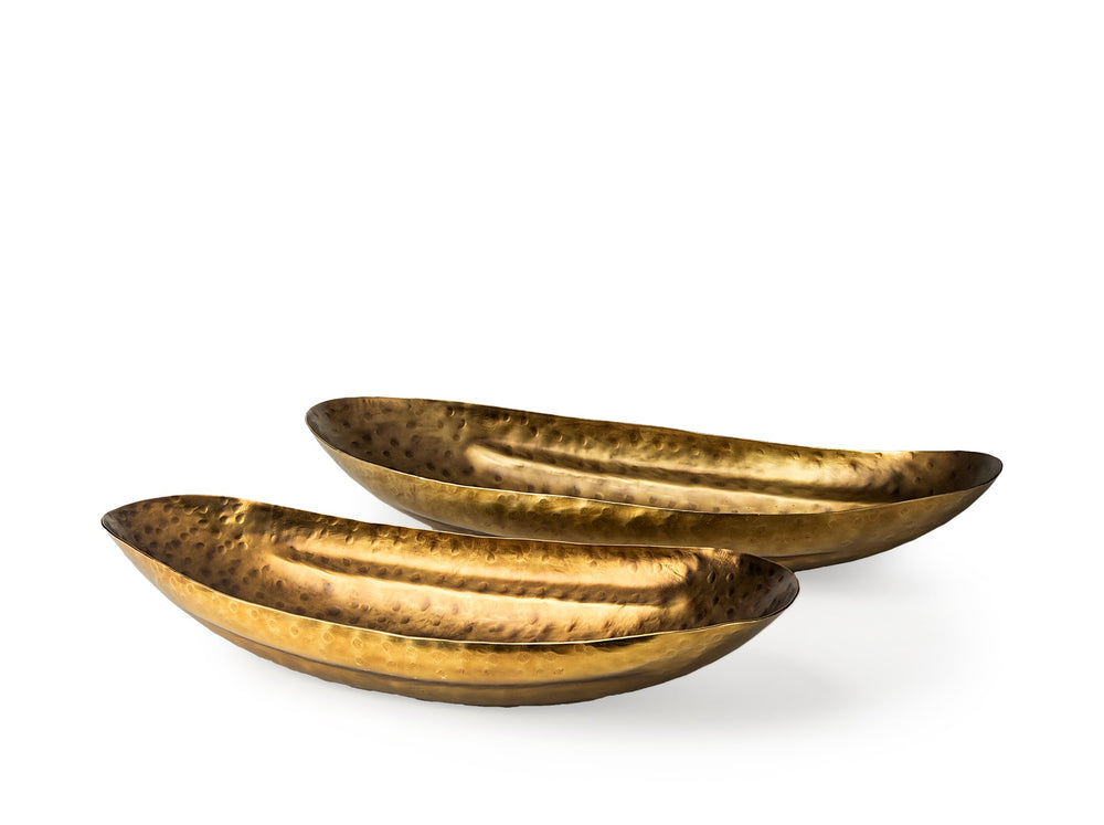 Two gold metallic bowls on a white background