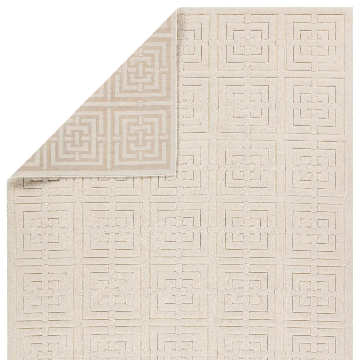 A beige area rug with a geometric pattern