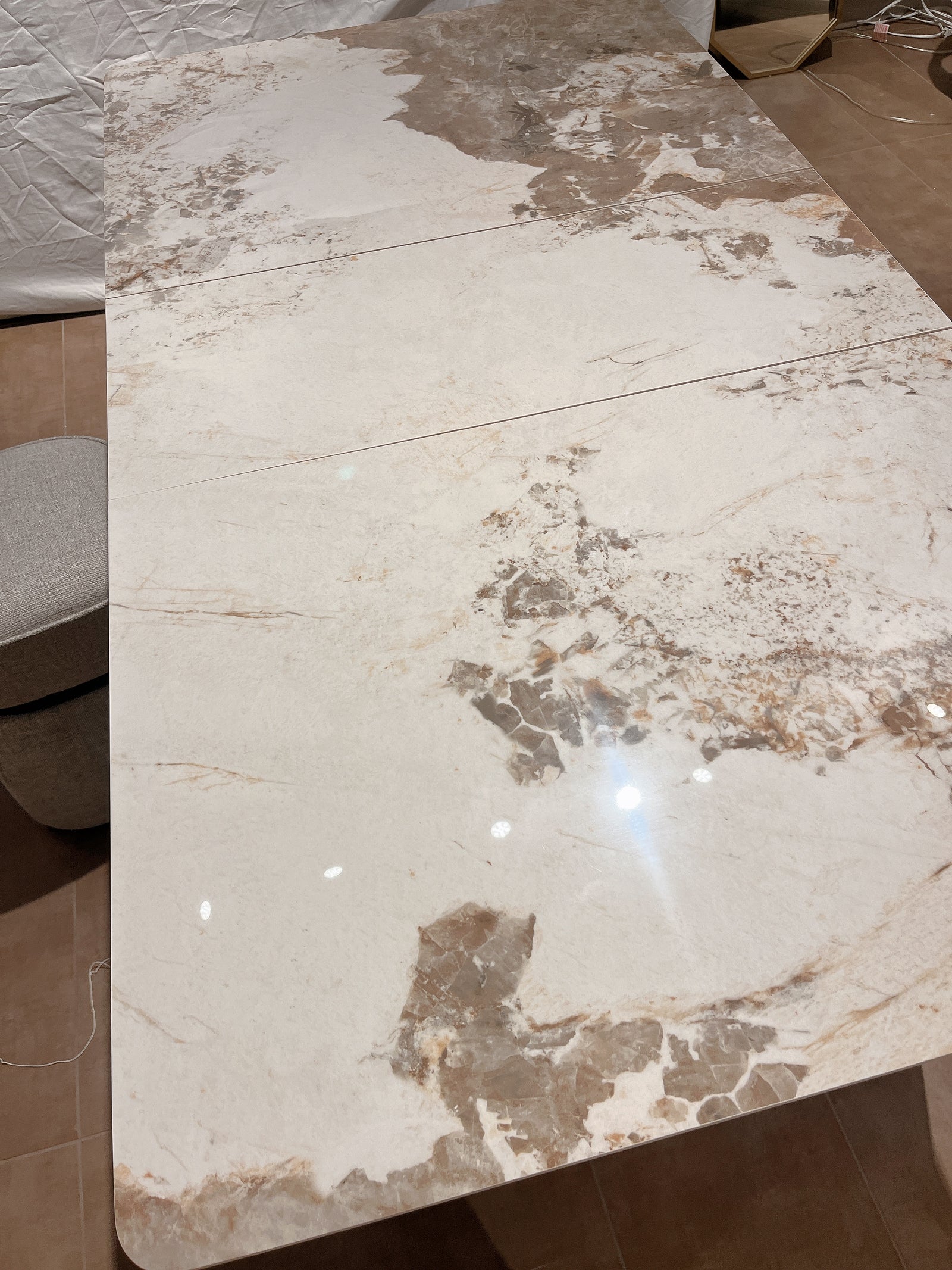 Marble-patterned table top with beige and brown tones