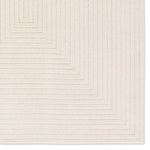 Textured beige area rug with geometric pattern