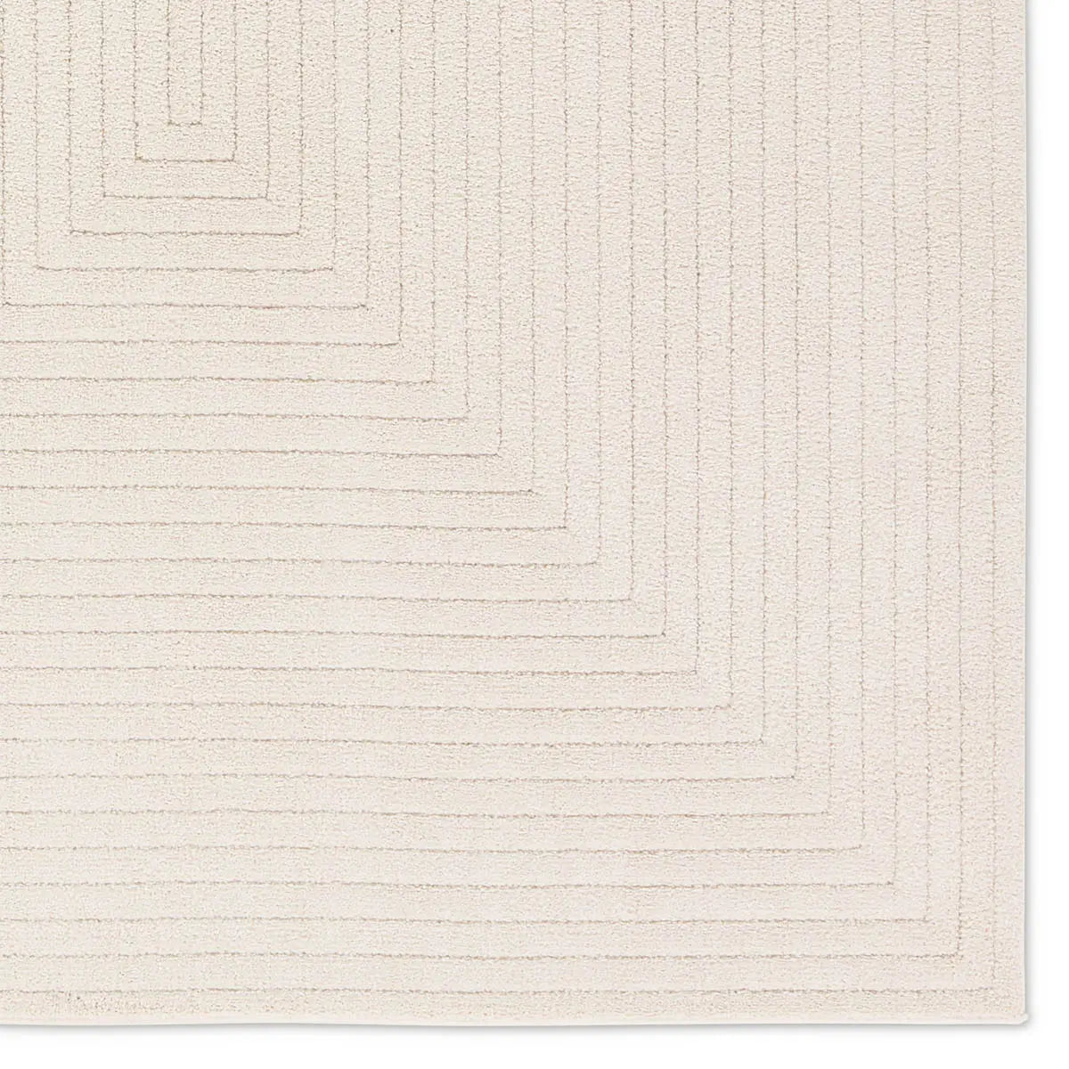 Textured beige area rug with geometric pattern