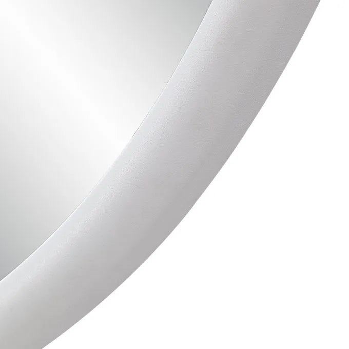 A round mirror with matt white frame with a white backgound