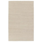 A beige area rug with a flatweave construction, laying on a white background.