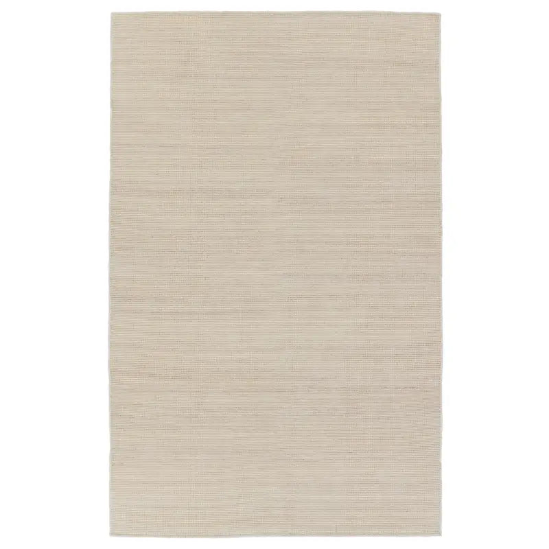 A beige area rug with a flatweave construction, laying on a white background.