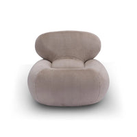 Modern beige armchair on a white background