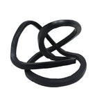 A black ribbon accent decor with an abstract, twisted shape.