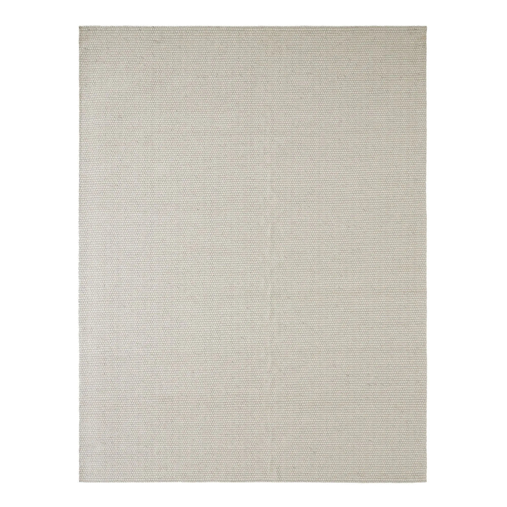 Beige area rug on a white background