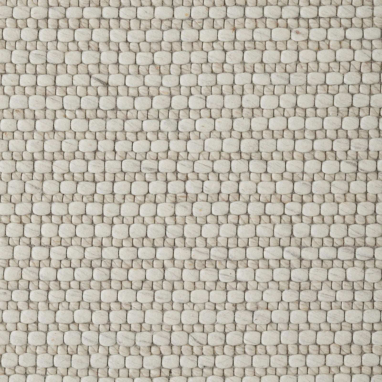 Close-up of a textured beige fabric pattern