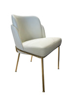 White chair with gold legs on a white background