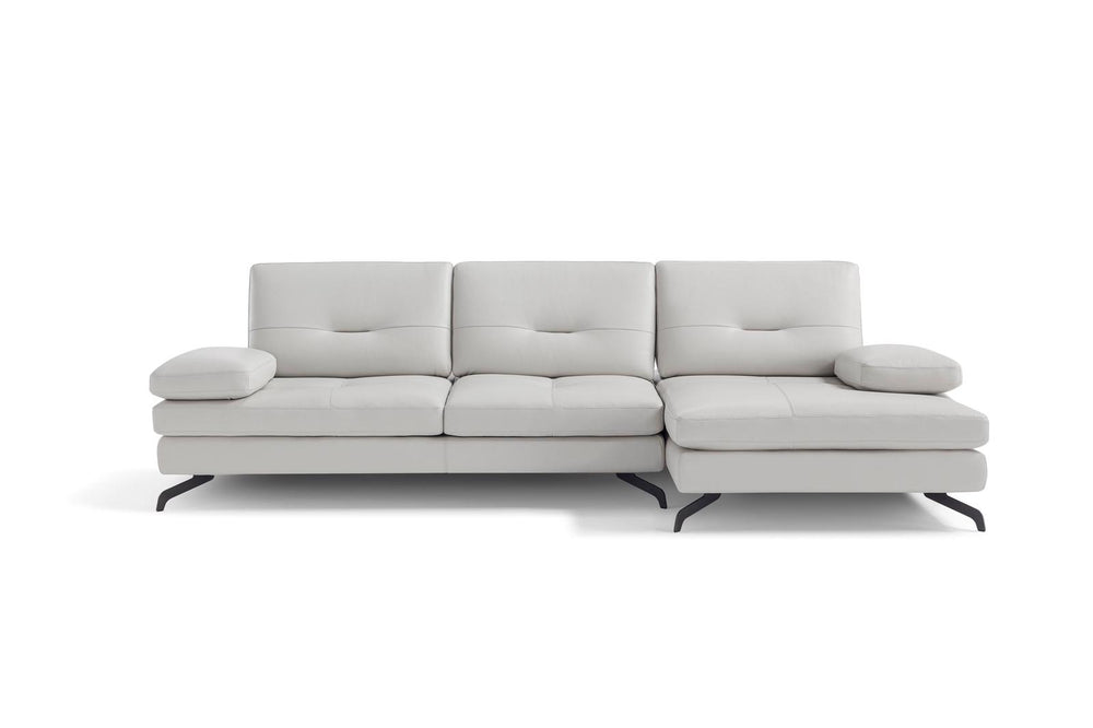 A beige upholstered sectional sofa with a chaise on the right side, featuring a contemporary design with three seat cushions and a back cushion.
