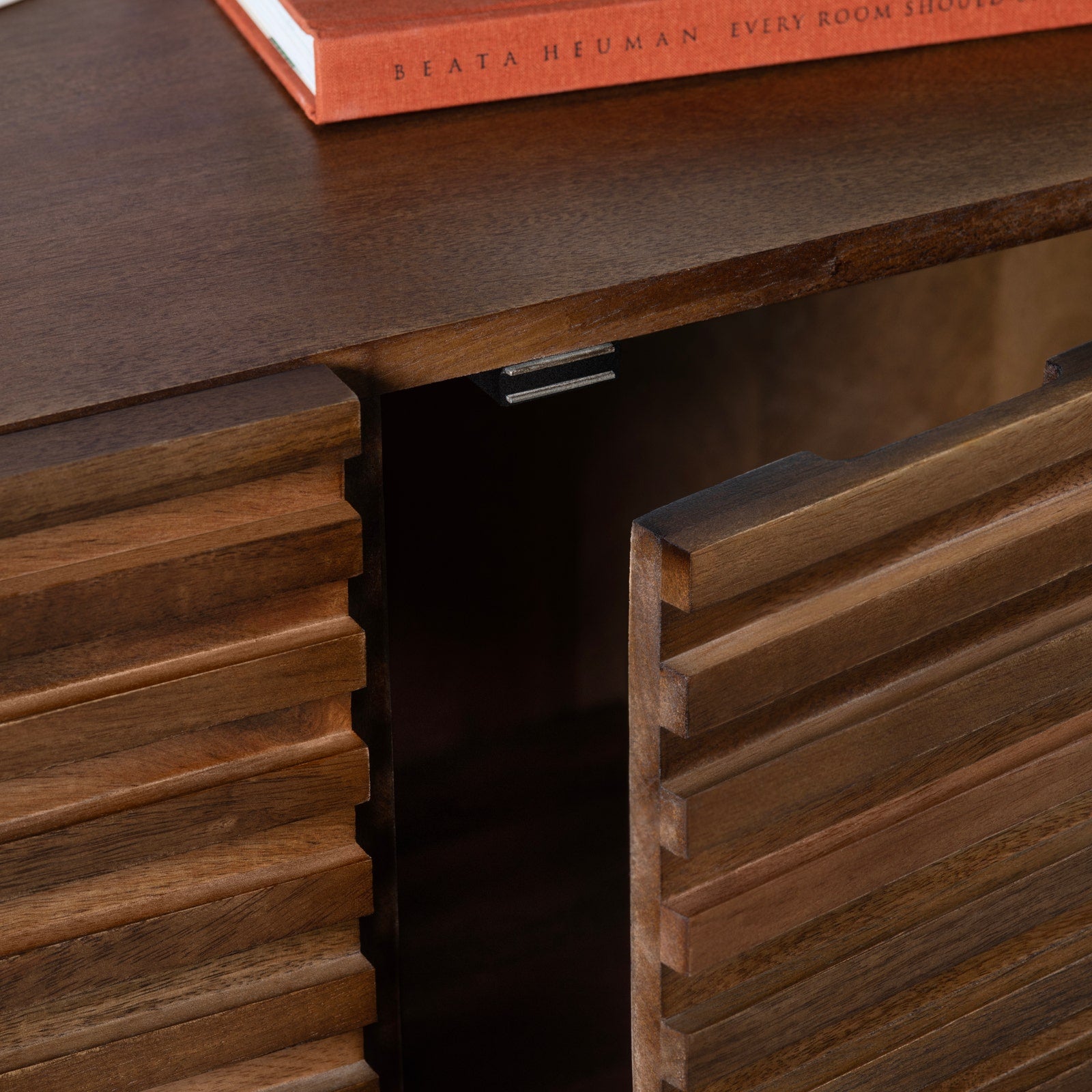 Close-up of a wooden desk with a book on top