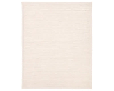 A beige, solid-colored area rug with a visible texture.