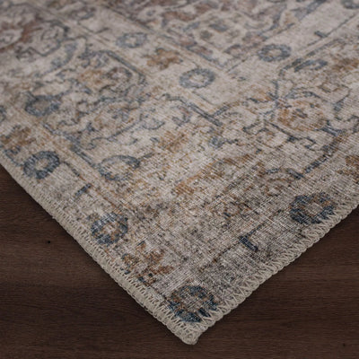 Close-up view of a multicolored area rug with a flatweave texture, showcasing patterns and colors.