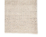A rectangular area rug in ivory and gray colors, handwoven from 100% polyester yarn.