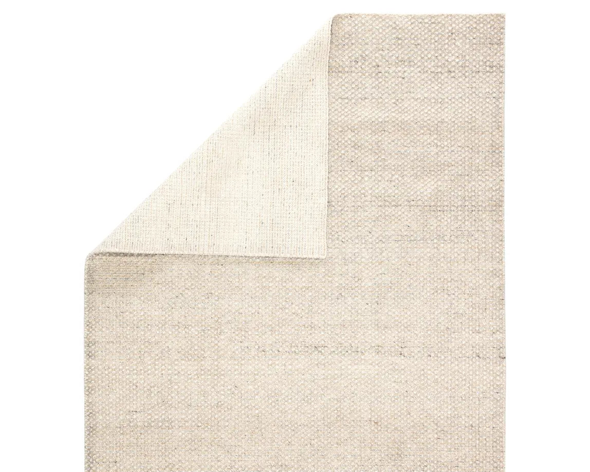 A rectangular area rug in ivory and gray colors, handwoven from 100% polyester yarn.