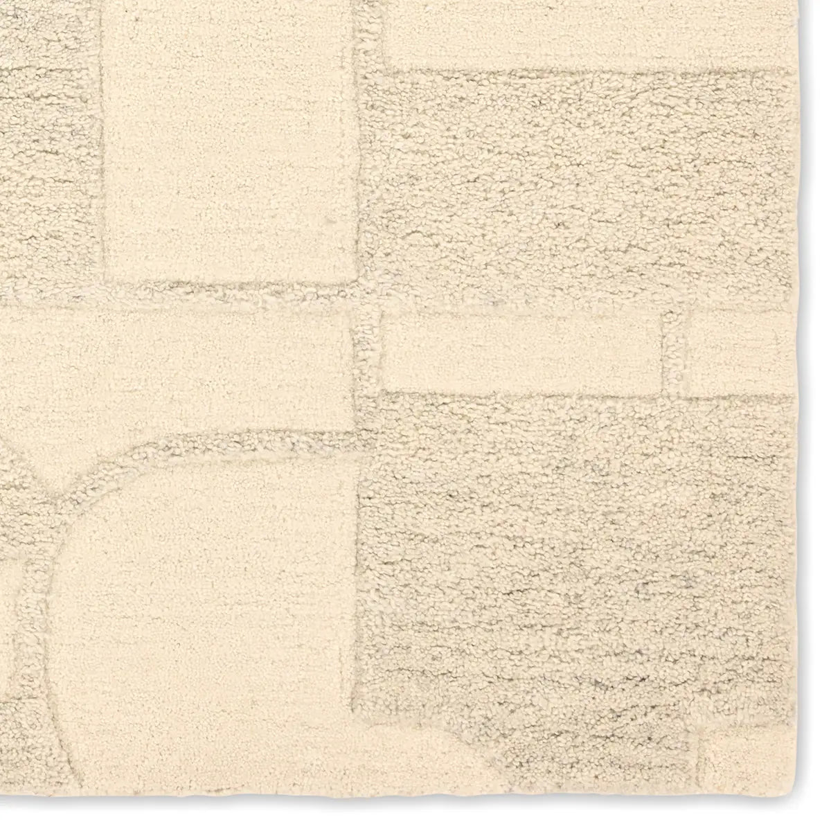 Beige textured rug with a checkered pattern