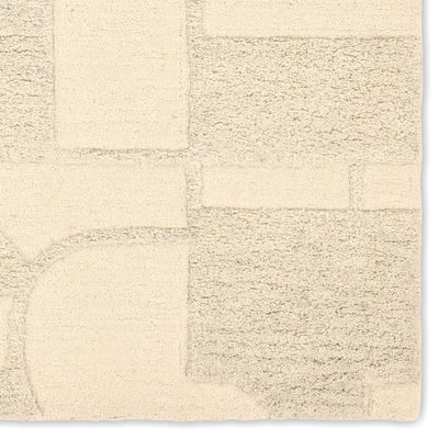 Beige textured rug with a checkered pattern