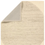 Beige textured rug corner on a white background