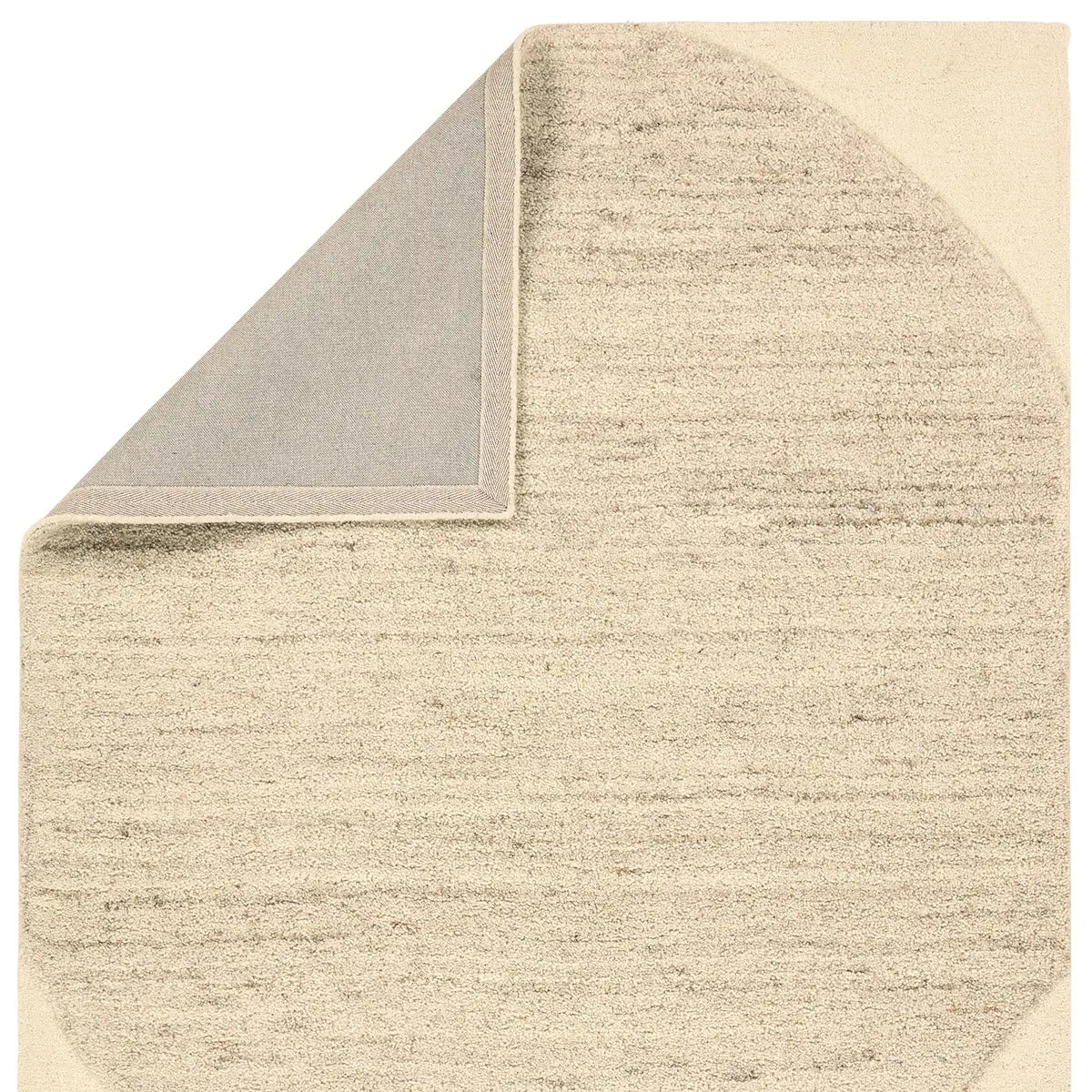 Beige textured rug corner on a white background