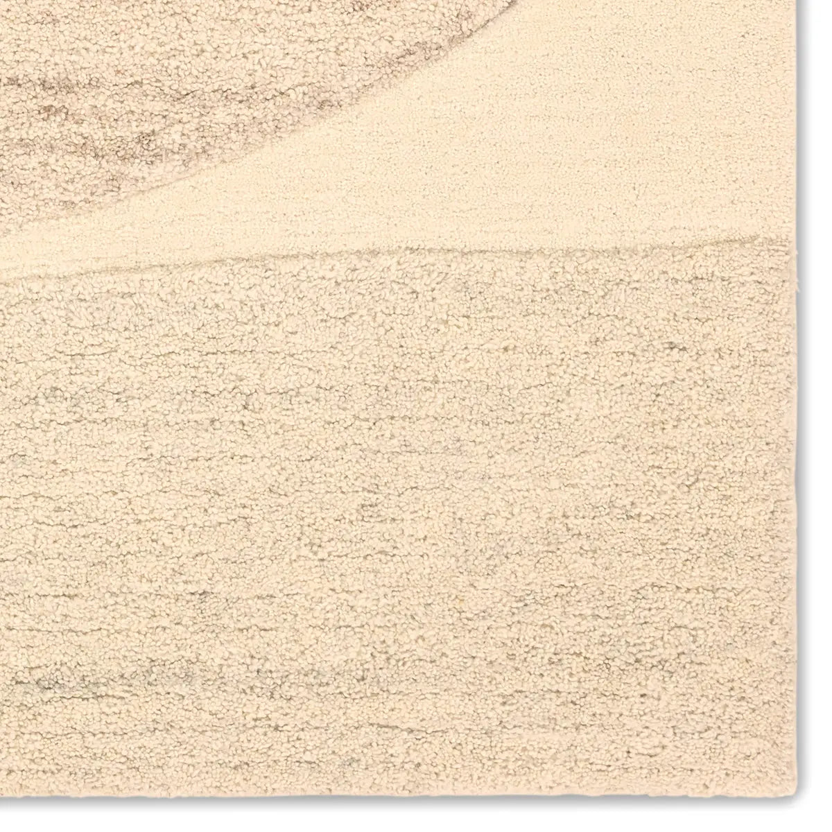 Beige textured rug with a subtle pattern