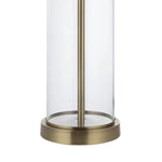 Cylindrical glass lantern with brass base on a white background