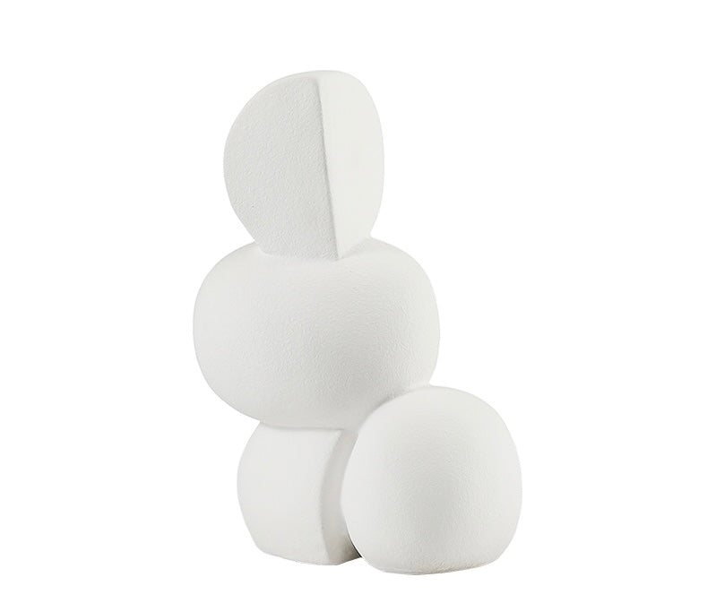 An off-white porcelain decorative figure resembling a stylized plant or flower, with a smooth and glossy finish.