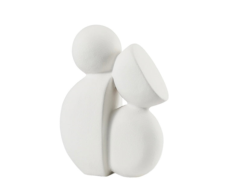 An off-white porcelain decor object designed in the shape of a stylized plant or flower with a smooth finish.