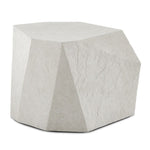 A modern hexagonal side table or stool with a textured, stone-like surface in a light gray color, shown on a plain white background.
