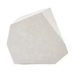 Geometric stone sculpture on a white background