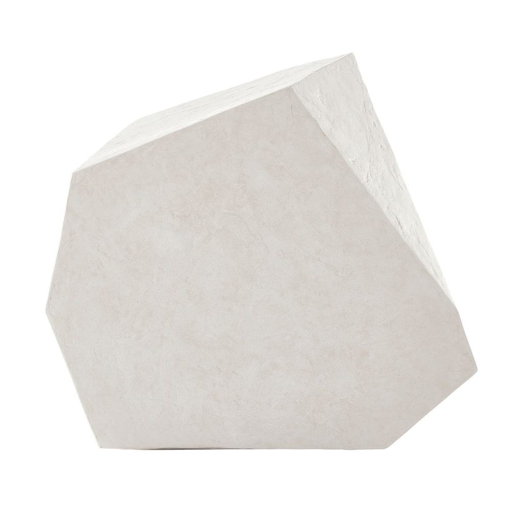 Geometric stone sculpture on a white background