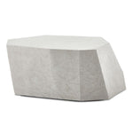 Geometric stone-like ottoman on a white background